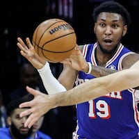 Sixers Justin Edwards looks to pass around Thunder Alex Caruso during the 1st quarter at the Wells Fargo Center in Philadelphia, Tuesday, January 14, 2024.