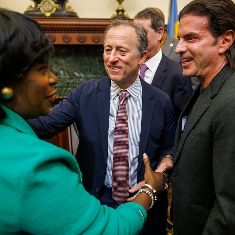 Philadelphia Mayor Cherelle Parker shakes hands with David Adelman. Center is Josh Harris, Sixers owner.  Cherelle Parker held presser in her Mayors Reception Room regarding the Sixers changing directions on controversial Center City arena, Monday, Jan. 13, 2025.