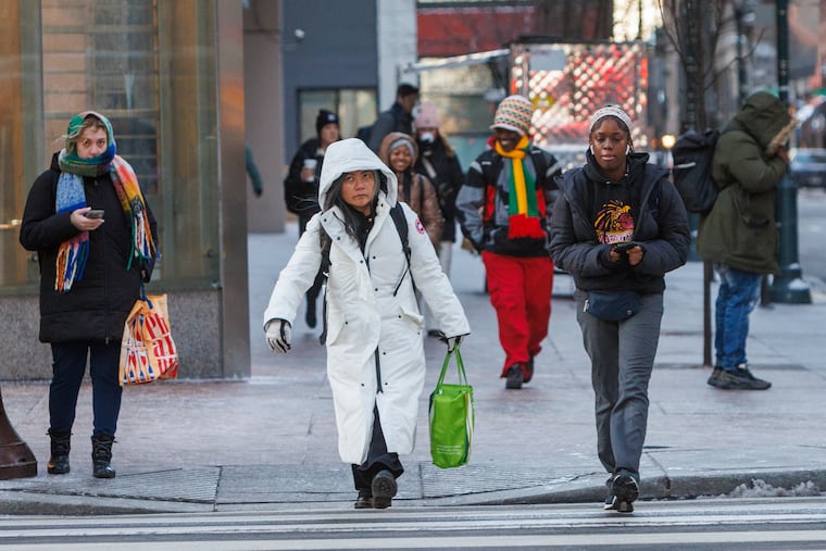 Pedestrians bundled up for the cold and winds on Tuesday. They'll have even more wind to deal with on Thursday.