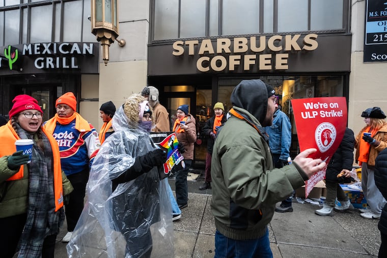 Starbucks workers strike outside the 16th and Walnut location, in Philadelphia, Tuesday, December 24, 2024.