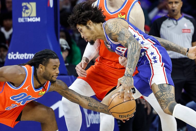 Sixers forward Kelly Oubre Jr. (right) was the lone starter to play against the Thunder on Tuesday night.