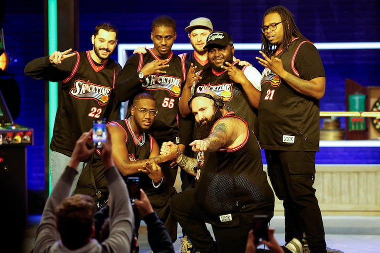 Members of Snacktime, the house band on Jason Kelce's new "They Call It Late Night with Jason Kelce" on ESPN, pose for a photograph before the start of the show at Union Transfer on Jan. 3.