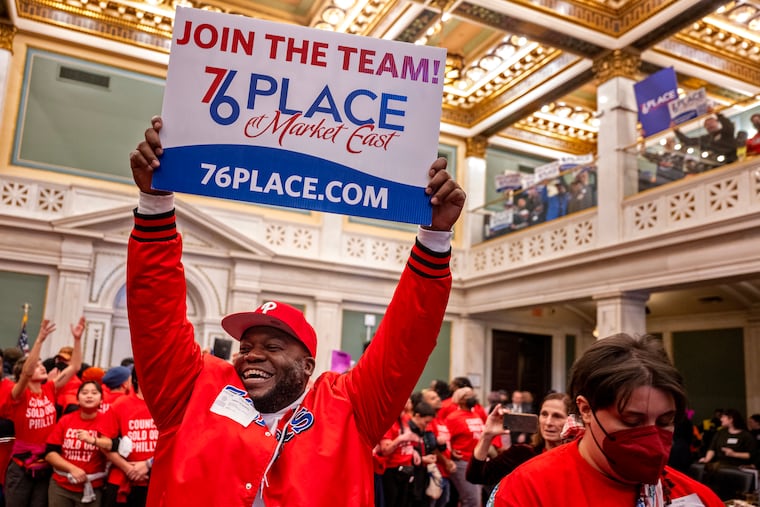 A Center City arena supporter celebrates before City Council gave final approval to the Sixers arena during its final meeting in December.