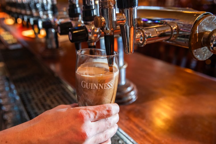 A pint of Guinness is poured at the Plough & the Stars, the Old City pub where sales of Guinness have been up about 10% in recent months.