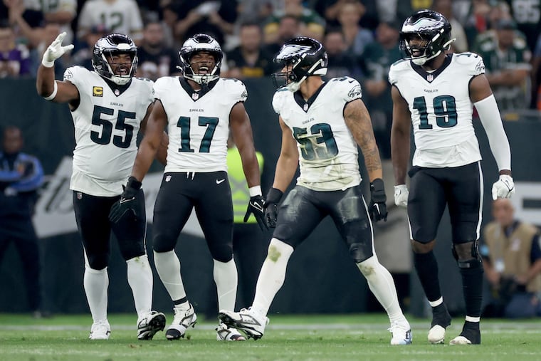 From left, Brandon Graham, Nakobe Dean, Zack Baun, and Josh Sweat celebrate a defensive stop against  Green Bay on Sept. 6. Graham is done for the season, but the defense has thrived. 