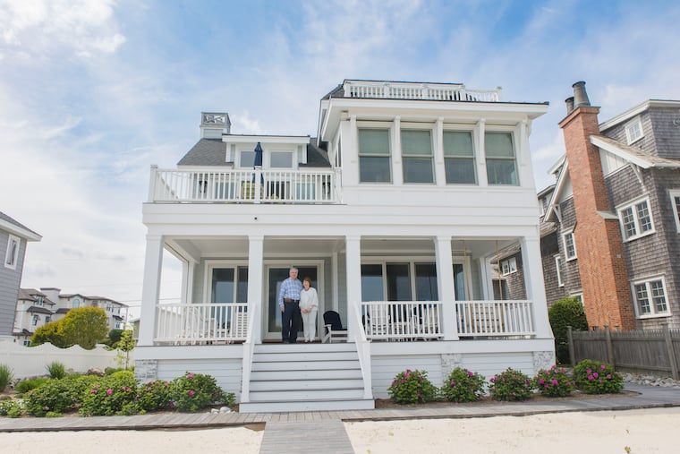 Mary Simmonds and Richard Stewart on the porch of their house in Avalon, N.J. Simmonds’ parents owned the original house on the property that they had purchased in 1972. In 2021, the couple razed the home and built their dream house.