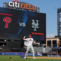 Phillies third base Alec Bohm throws during a workout at Citi Field.