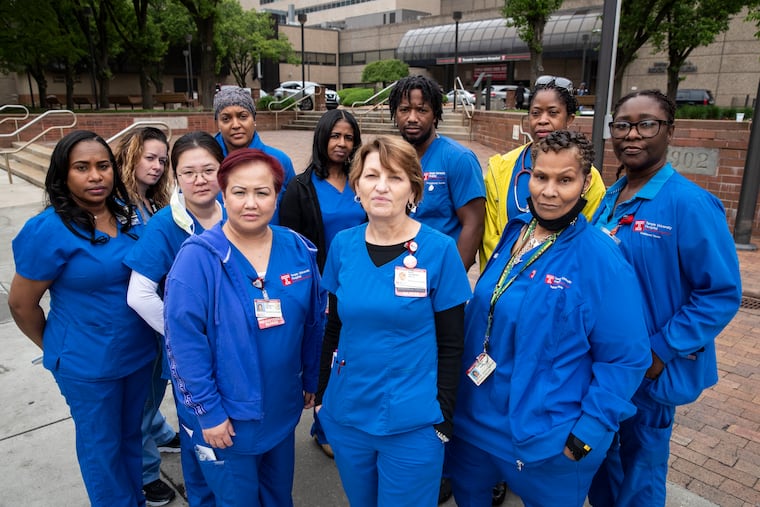 Mary Adamson (center), an ICU Nurse at Temple University Hospital, with other Temple nurses. Adamson wrote a piece about all of the nurses that remain in the profession.