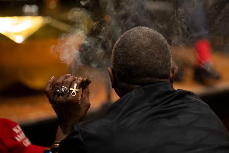 People listen to Congressmen Byron Donalds and Wesley Hunt speak during Congress, Cognac and Cigars at the Cigar Code in Philadelphia in June.