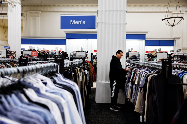 Customer Fazal Khaliq shops inside Macy’s at 13th and Market Streets on Thursday. The Center City and Exton locations are set to close along with dozens of other stores nationwide.