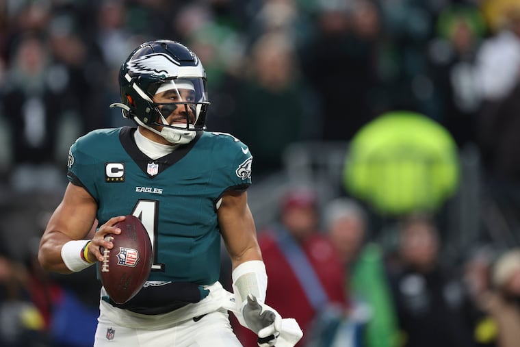 Philadelphia Eagles quarterback Jalen Hurts looks for a receiver during the first quarter of the NFL wild-card playoff football game against the Green Bay Packers Sunday, Jan. 12, 2025, in Philadelphia,PA. He found Philadelphia Eagles wide receiver Jahan Dotson for a touchdown.