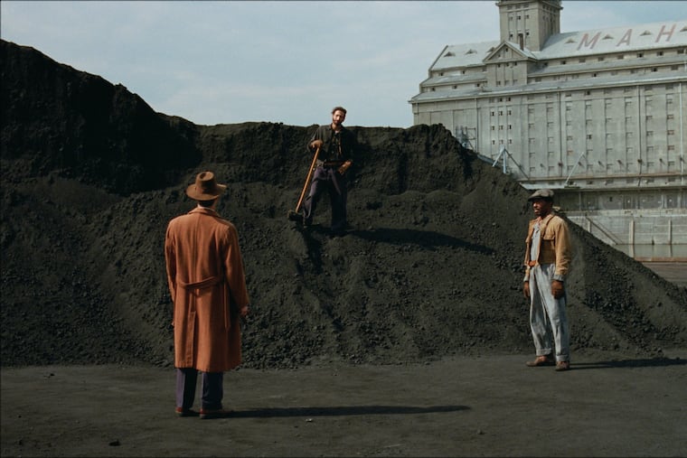 Guy Pearce, Adrien Brody, and Isaach DeBankolé in "The Brutalist." Shot in Hungary, the scene depicts Brody's character shoveling coal in 1950s' Philadelphia.