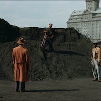 Guy Pearce, Adrien Brody, and Isaach DeBankolé in "The Brutalist." Shot in Hungary, the scene depicts Brody's character shoveling coal in 1950s' Philadelphia.