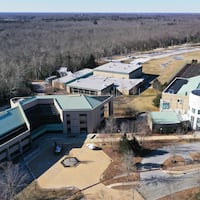 A 2019 image of the former Burlington County College campus in Pemberton Township shows (from left) an academic building, since demolished, and the gym (center) and library, which are now set for demolition as well.