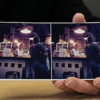 David O'Neil, former manager of Reading Terminal Market, shows an old photo taken by Laszlo of the market.