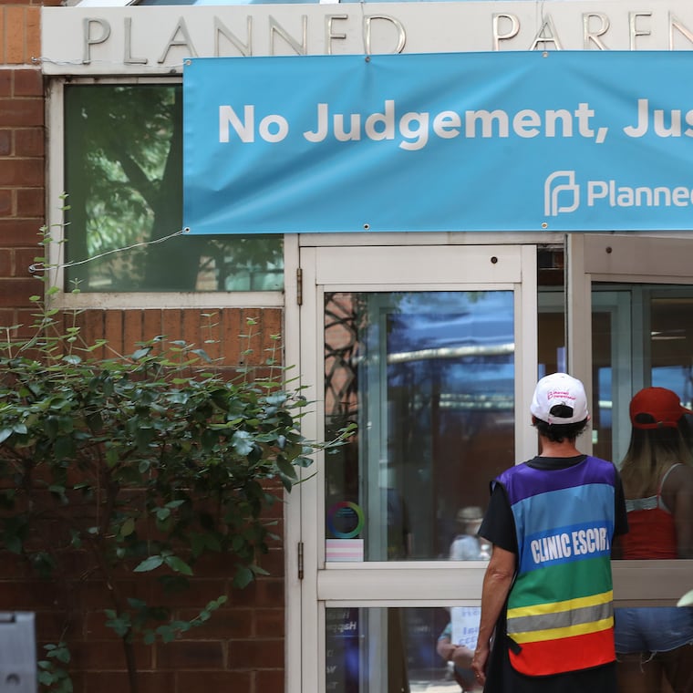 Bobbie Trotenberg, a patient escort, watched as a patient entered Planned Parenthood in Center City after she walked her to the door in Philadelphia on July 20.