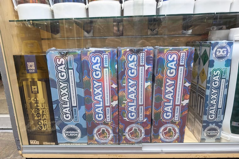 Fruit-punch-flavored “Galaxy Gas” brand nitrous oxide tanks for sale on the Lower East Side of Manhattan early this month. MUST CREDIT: Shane O'Neill/The Washington Post