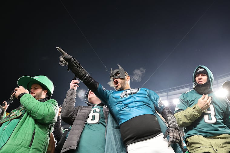 Eagles fans celebrate after the Philadelphia Eagles defeat the Green Bay Packers in the NFL wild-card playoff game.