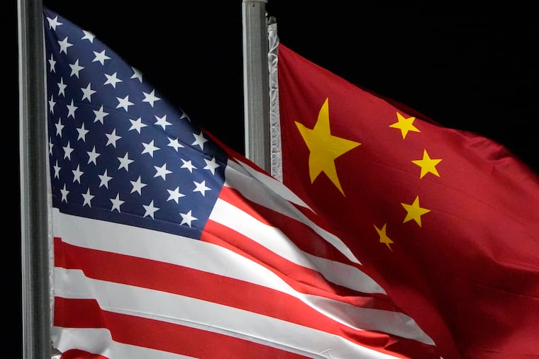 The American and Chinese flags wave at Genting Snow Park in 2022 in Zhangjiakou, China.