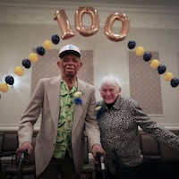 Herman Whilby (left), 106, and Sarah Narvel (right), 103, pose under a balloon arch during the annual Delaware County Centenarian Celebration in Drexel Hill on Thursday, May 16, 2024.