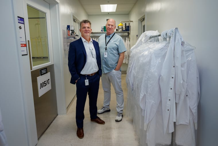 Dennis Williams (left), Senior Vice President, Late Stage Development and Mark Stielow (right), Vice President U.S. Manufacturing and Technical Operations at Adaptimmune in the Navy Shipyard, Thursday, Sept. 12, 2024. After getting approval for a new type of cancer therapy (Tecelra) that uses the immune system to target cancer cells, the company is gearing up for patient orders to arrive.