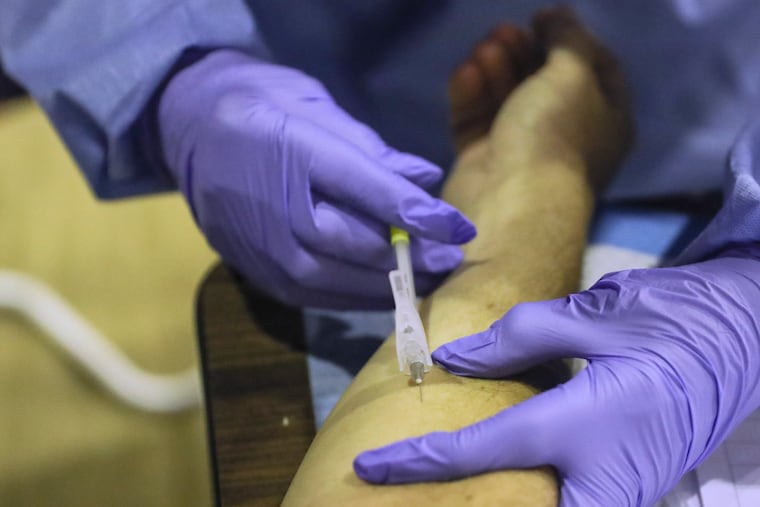 A patient receives the monkeypox vaccine at the Dr. Ala Stanford Center for Health Equity in North Philadelphia in 2022. The Black Doctors Consortium hosted the clinic.