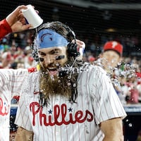 Phillies Bryson Stott left gives Brandon Marsh a water bath after they beat the Cubs 9-6 at Citizens Bank Park in Philadelphia, Wednesday, September 25, 2024