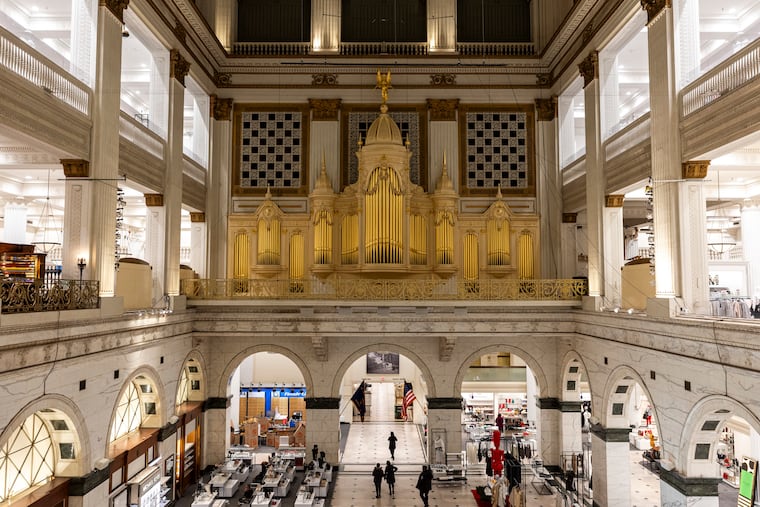 People gather inside Macy’s to listen to one of the last moments of hearing the Wanamaker Organ in Philadelphia, Pa., on Friday, Jan. 10, 2025.