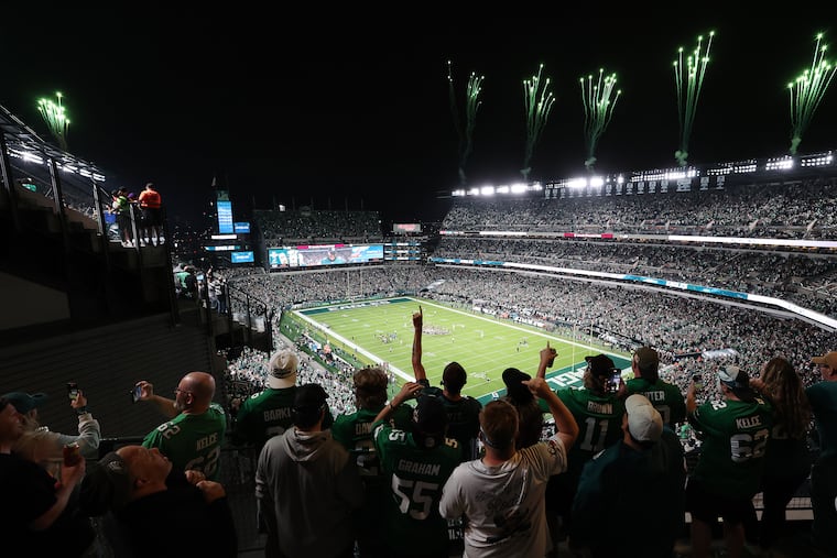 Fans cheer as fireworks light up the stadium before kickoff of an Eagles game earlier this season.