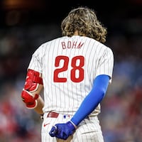 Phillies Alec Bohm slams his helmet and it breaks after striking out against the Cubs for the third out during the 8th inning at Citizens Bank Park in Philadelphia, Tuesday, September 24, 2024 Cubs beat the Phillies 10-4.